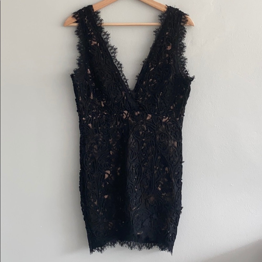 A. Peach black sleeveless lace dress w/ low Vneck